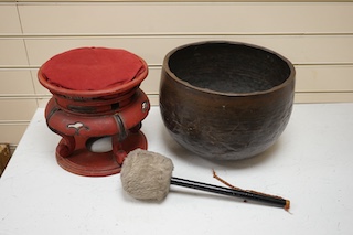 A large Japanese bronze temple bowl with beater, on red lacquered stand. Bowl 33cm diameter. Condition - fair to good